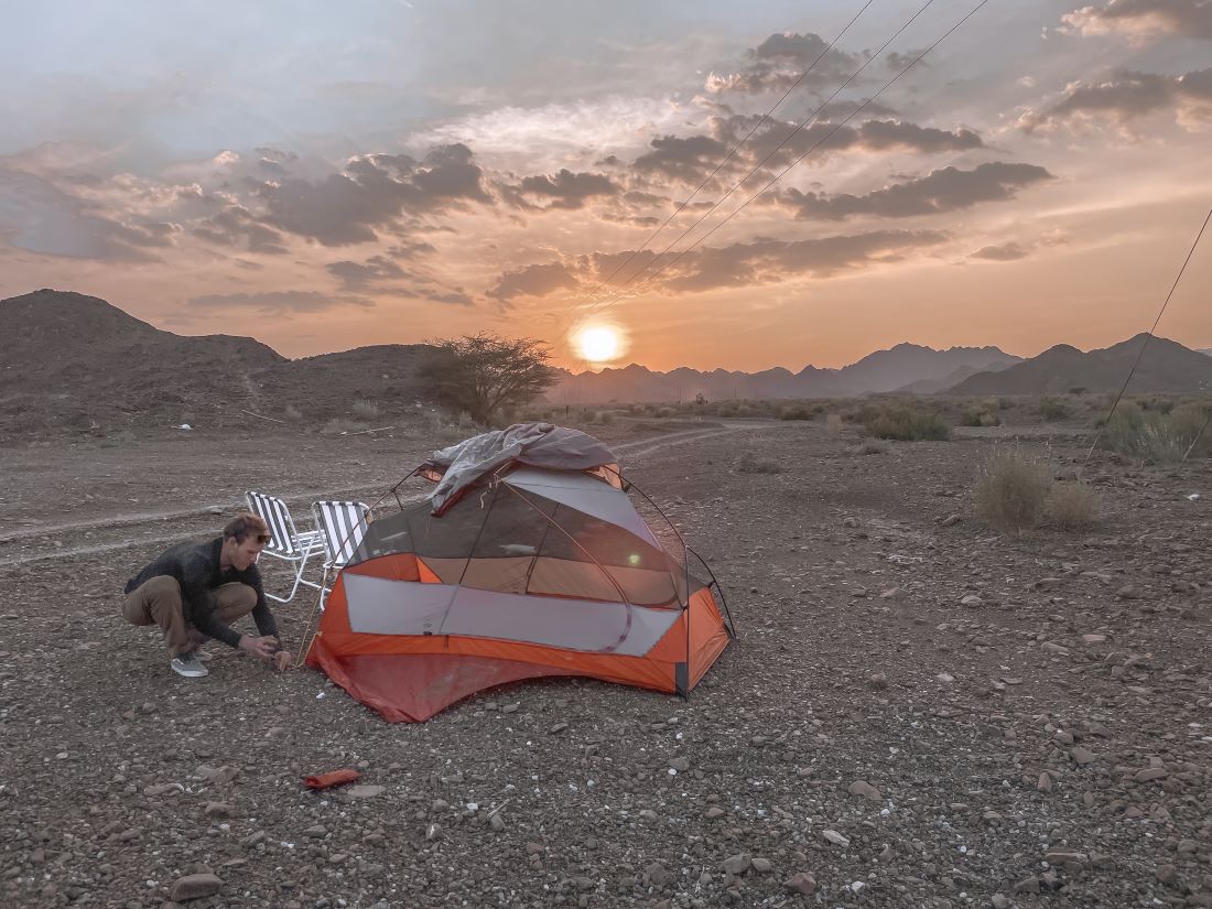 camping in oman sunset featured image