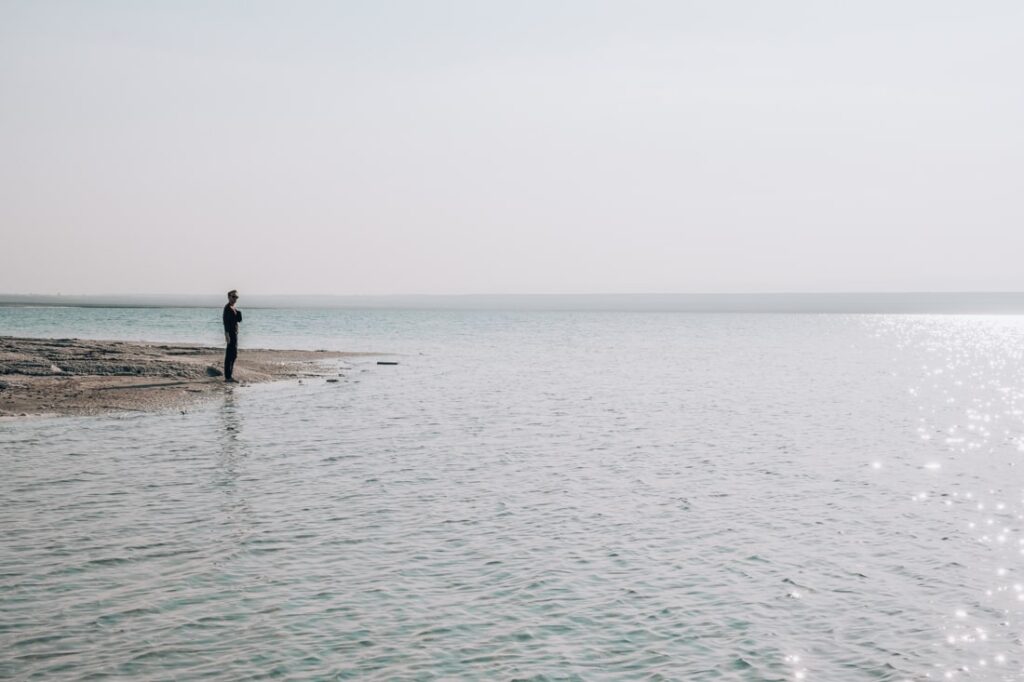 Matthias standing on the shore of the Dead Sea