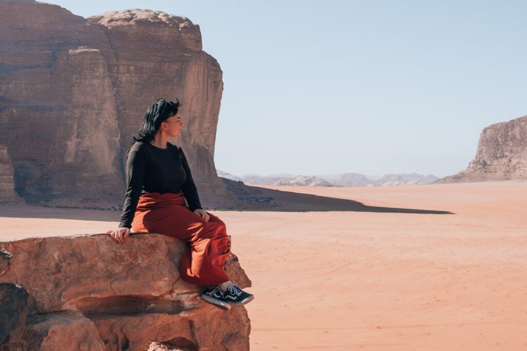 mieke sitting on rock in wadi rum desert in Jordan