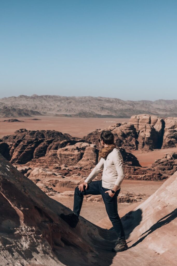 matthias standing in between rocks with stunning views