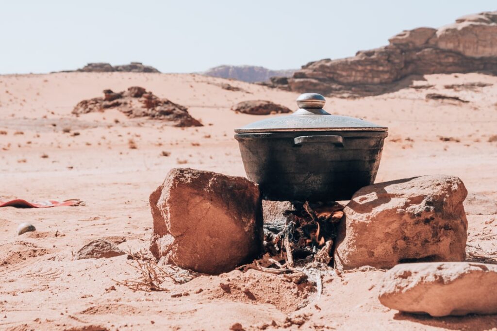 cooking pot on burning wood in the desert