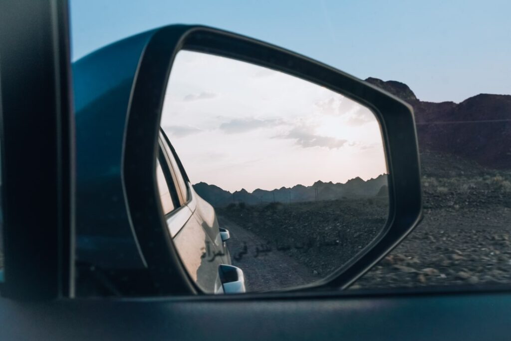 car mirror landscape when driving in Oman