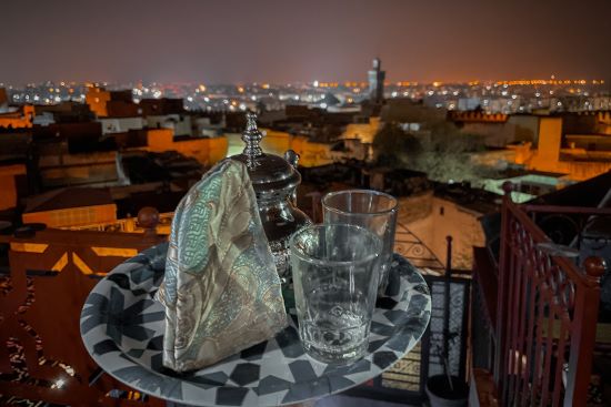 drinking moroccan tea at  rooftop terrace of Riad Mehdi in Meknès in Morocco