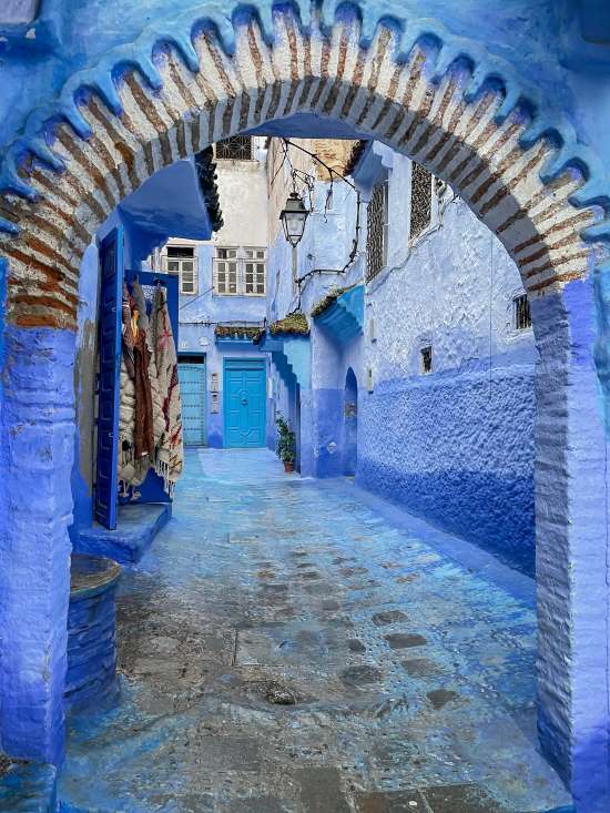 arch in blue street chefchaouen morocco