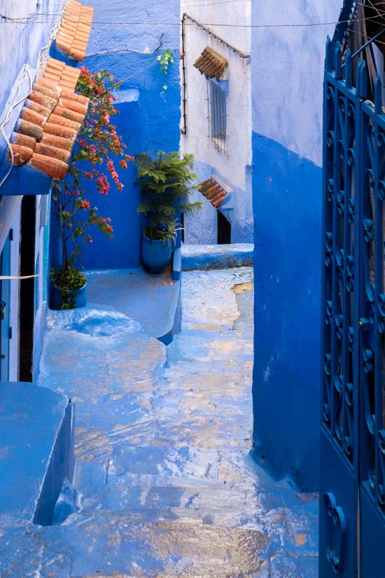 blue street chefchaouen with orange colored roof