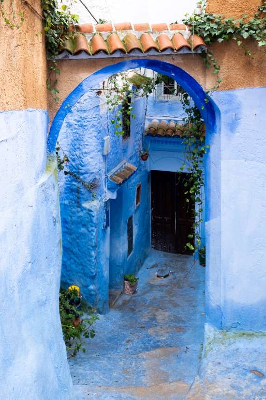 blue street chefchaouen morocco arch