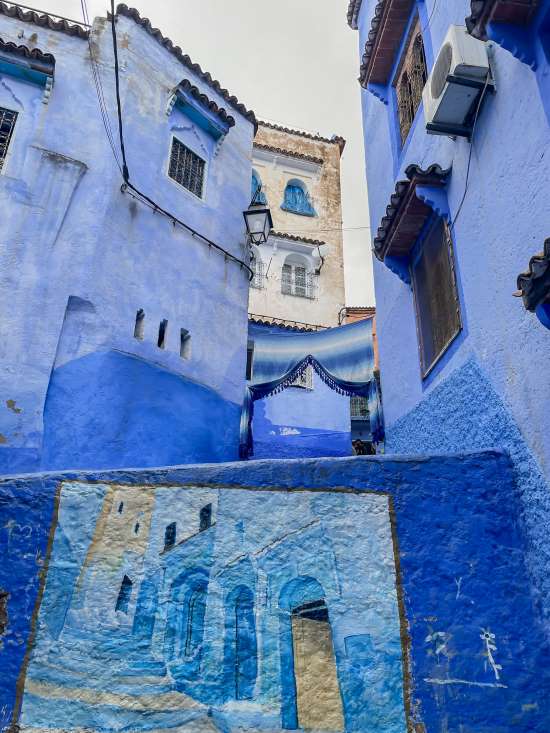 wall painting chefchaouen morocco travel guide