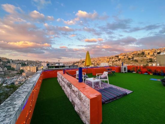 Booking where to stay Amman Jordan rooftop terrace medusa homestay