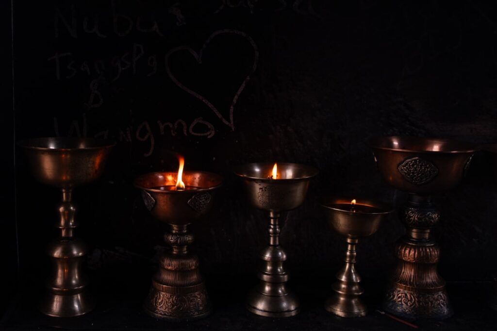 Butter lamps Spituk monastery Ladakh India