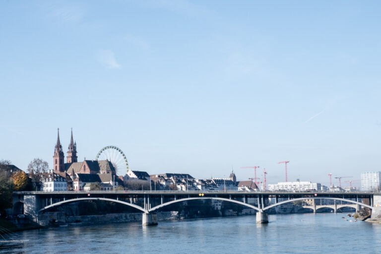 city landscape of Basel with Rhine river and old buildings