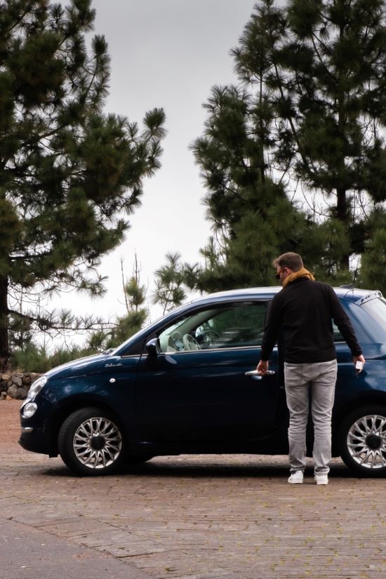 Matthias opening our rental car along the road in Teide National Park